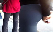Softcore video of a young girl with a round butt in tight leggings waiting for the bus